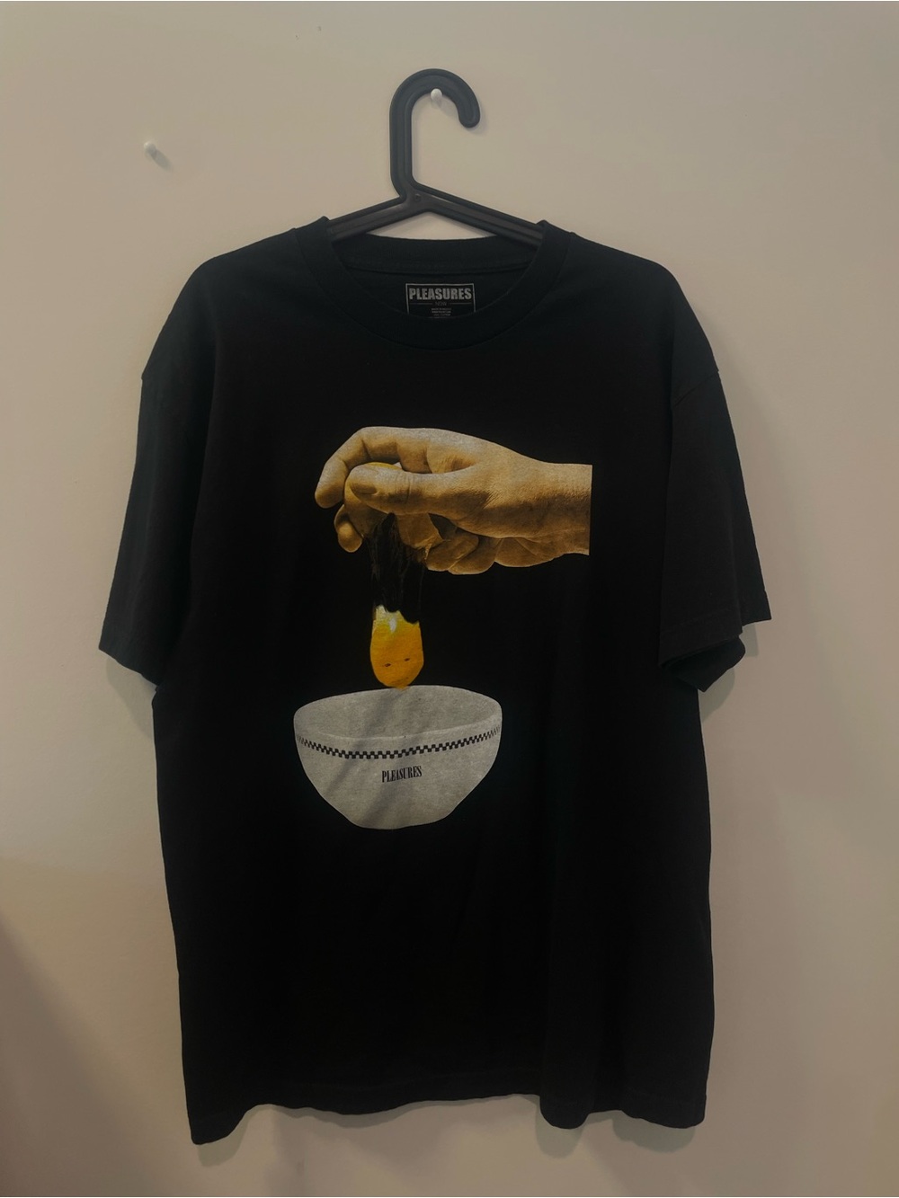 Pleasures Men’s Black Graphic Tee with Yellow Egg Motif